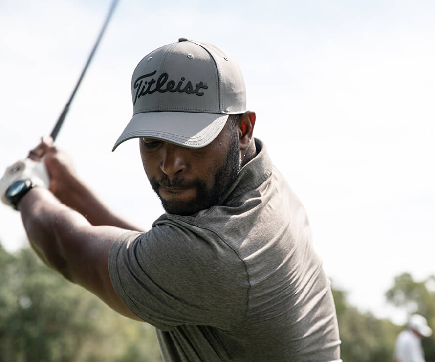 golf action shot of golfer mid-swing