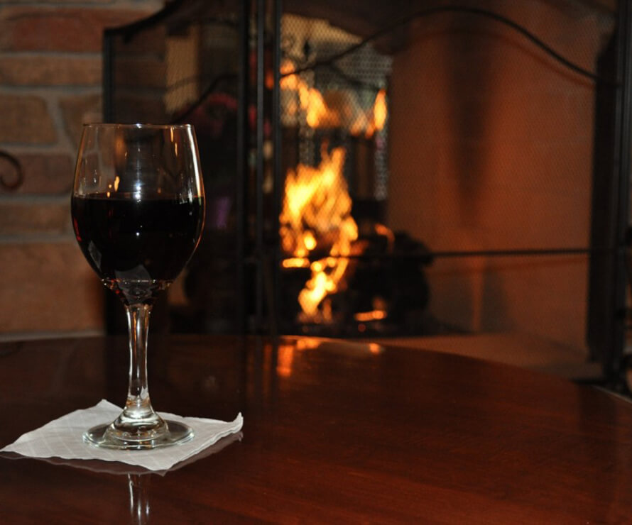 wine by the fireplace